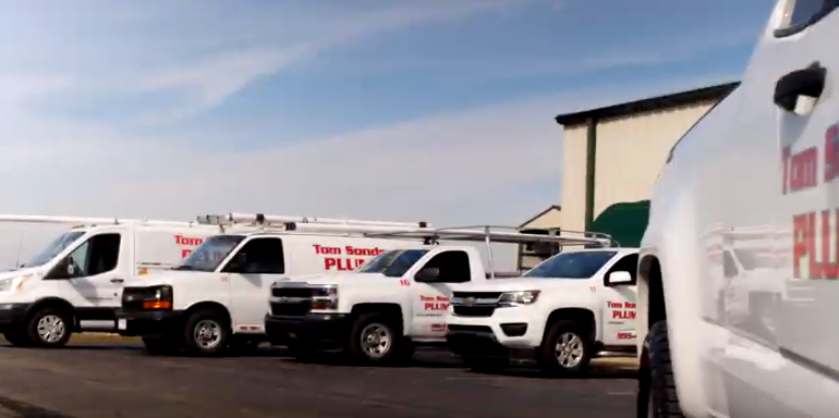 Fleet of Tom Sondergeld Plumbing vehicles